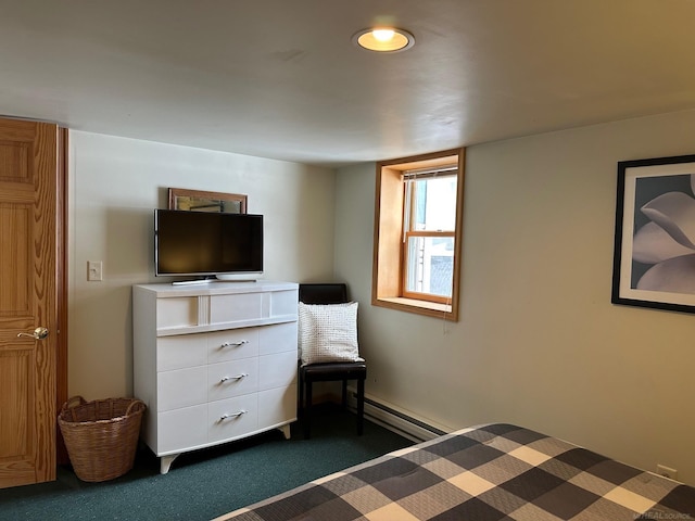unfurnished bedroom with a baseboard heating unit and dark colored carpet