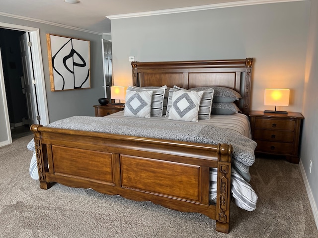 carpeted bedroom with crown molding and baseboards
