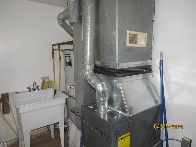 505 Washington St, Marine City, MI 48039 - utilities with a sink and heating unit