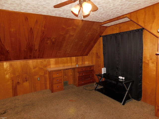 27324 Larchmont St, Saint Clair Shores, MI 48081 - carpeted home office with lofted ceiling, wood walls, and a ceiling fan