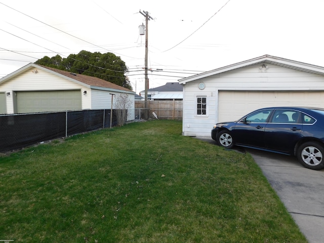 27324 Larchmont St, Saint Clair Shores, MI 48081 - view of yard featuring an outdoor structure, fence, and a detached garage
