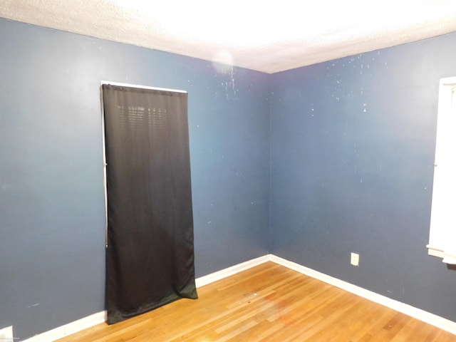 27324 Larchmont St, Saint Clair Shores, MI 48081 - unfurnished room featuring baseboards and wood finished floors