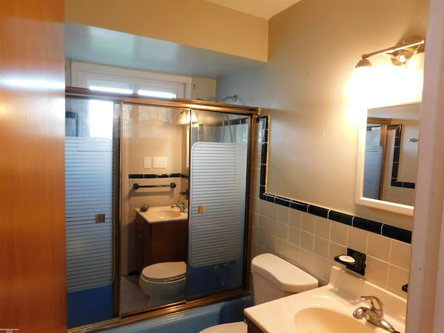 27324 Larchmont St, Saint Clair Shores, MI 48081 - full bathroom featuring vanity, tile walls, a wainscoted wall, and toilet
