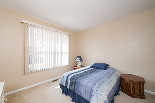 bedroom with visible vents, baseboards, and carpet floors