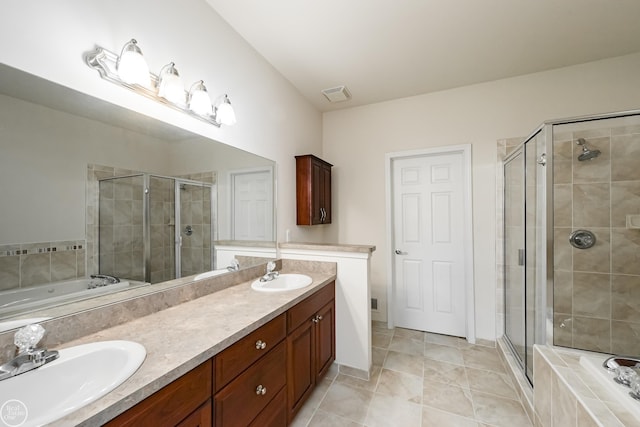 full bathroom featuring a shower stall, a bath, double vanity, and a sink