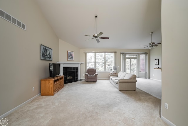 living area with visible vents, high vaulted ceiling, a ceiling fan, and light carpet