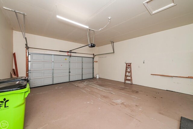 garage featuring a garage door opener