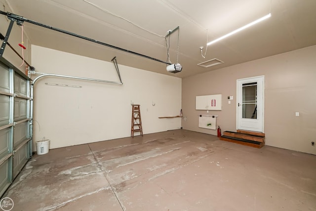 garage featuring a garage door opener