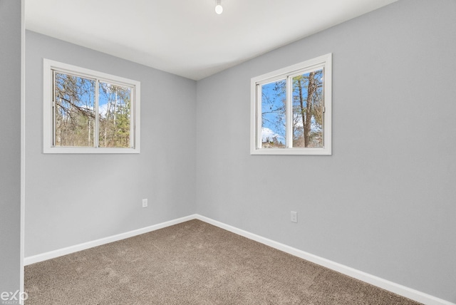 2407 Karen St, Prescott, MI 48756 - carpeted spare room featuring baseboards
