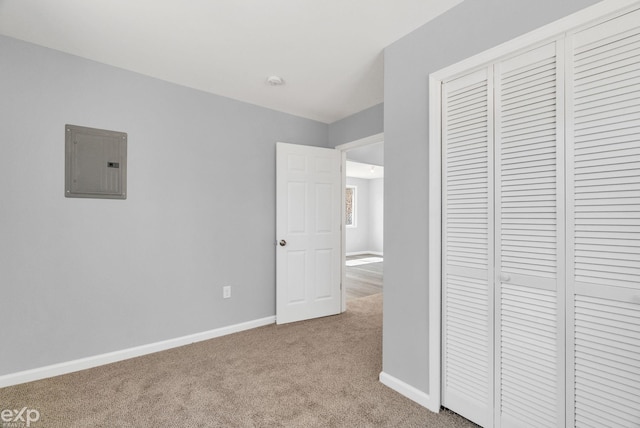 2407 Karen St, Prescott, MI 48756 - unfurnished bedroom with a closet, carpet flooring, baseboards, and electric panel