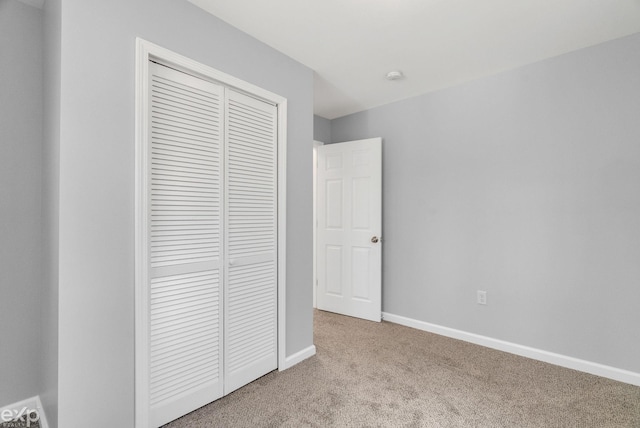 2407 Karen St, Prescott, MI 48756 - unfurnished bedroom with a closet, baseboards, and carpet