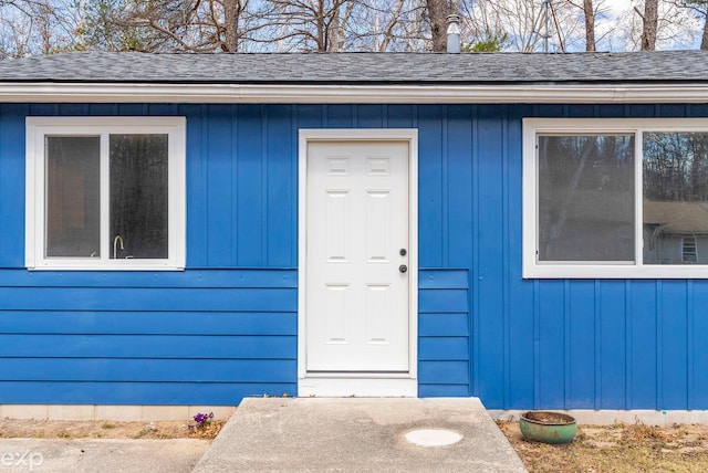 2407 Karen St, Prescott, MI 48756 - property entrance with board and batten siding and a shingled roof