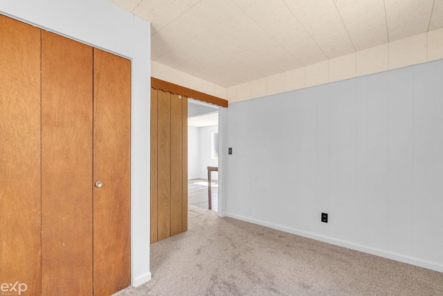 2407 Karen St, Prescott, MI 48756 - unfurnished bedroom with a closet and light colored carpet