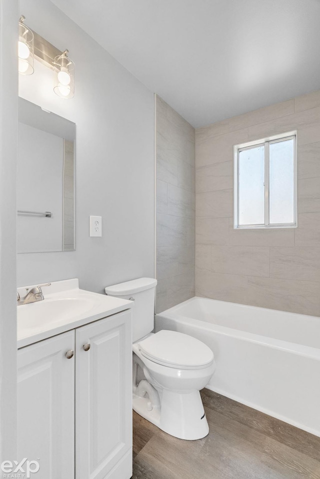 2407 Karen St, Prescott, MI 48756 - bathroom with toilet, wood finished floors, and vanity