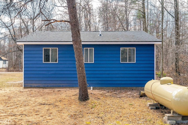 2407 Karen St, Prescott, MI 48756 - view of side of property featuring a shingled roof