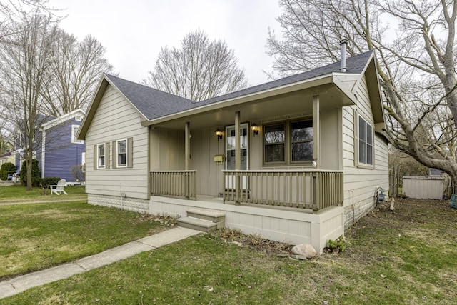 7173 Lake St, Lexington, MI 48450 - view of front of house with a porch, a front yard, a shingled roof, and board and batten siding