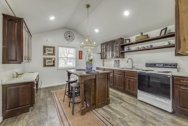 7173 Lake St, Lexington, MI 48450 - kitchen featuring lofted ceiling, open shelves, a sink, a center island, and white appliances