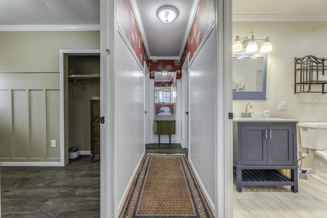 7173 Lake St, Lexington, MI 48450 - hall featuring wood finished floors, crown molding, and a sink