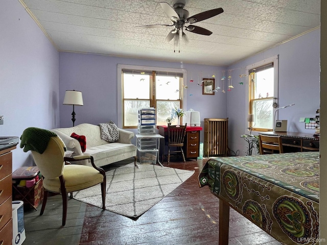 1215 Dakota Ave, Gladstone, MI 49837 - bedroom with multiple windows, wood-type flooring, a ceiling fan, and ornamental molding