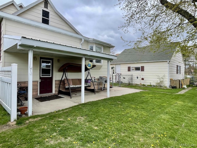 1215 Dakota Ave, Gladstone, MI 49837 - rear view of house featuring a patio area