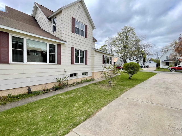 1215 Dakota Ave, Gladstone, MI 49837 - view of home's exterior featuring a yard