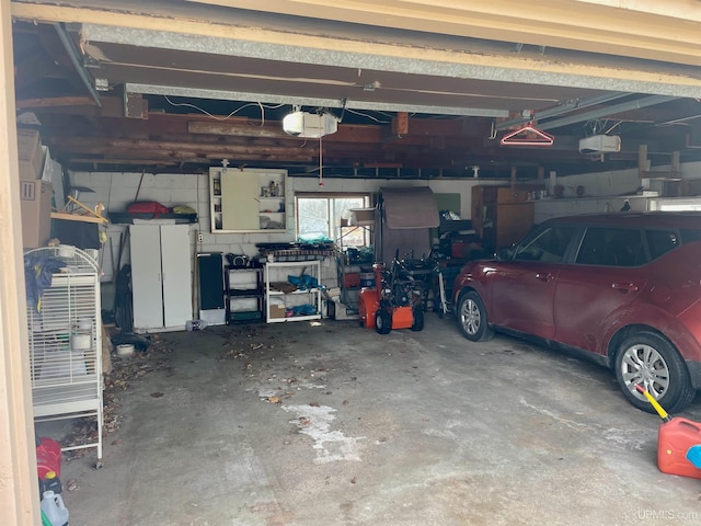 1215 Dakota Ave, Gladstone, MI 49837 - garage featuring a garage door opener