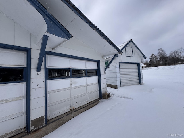 view of snow covered garage