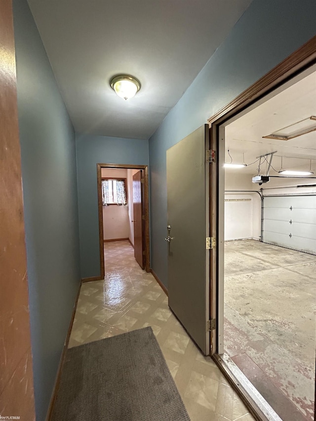 hall featuring baseboards