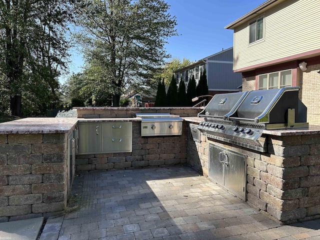 view of patio / terrace featuring exterior kitchen and area for grilling