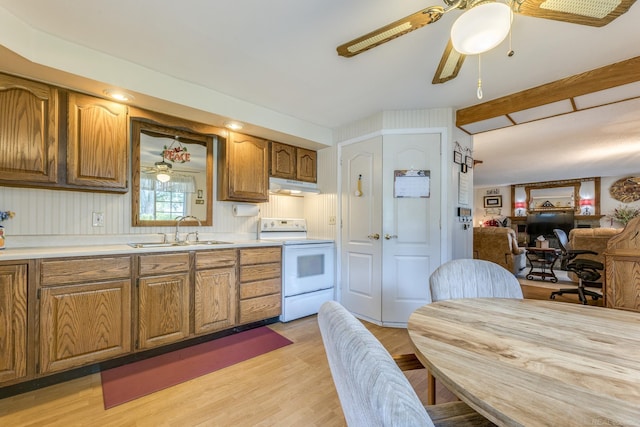 kitchen with a sink, ceiling fan, white electric stove, and under cabinet range hood