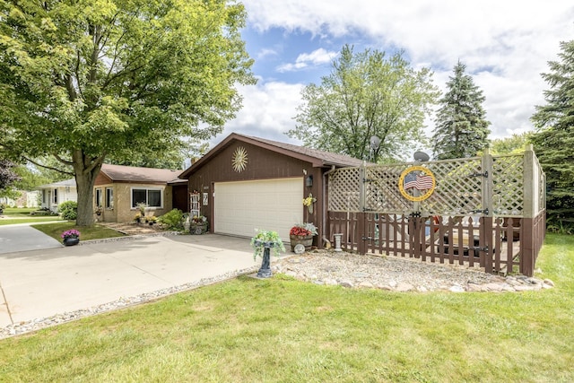 view of front facade with driveway, an attached garage, and a front lawn