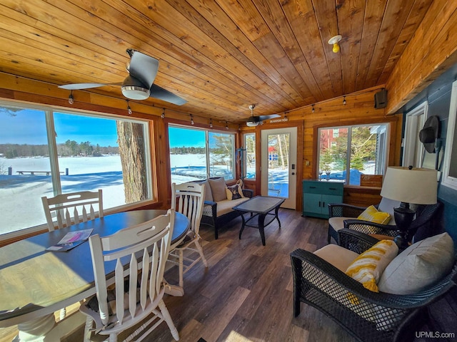 sunroom with wooden ceiling, ceiling fan, vaulted ceiling, and wood finished floors