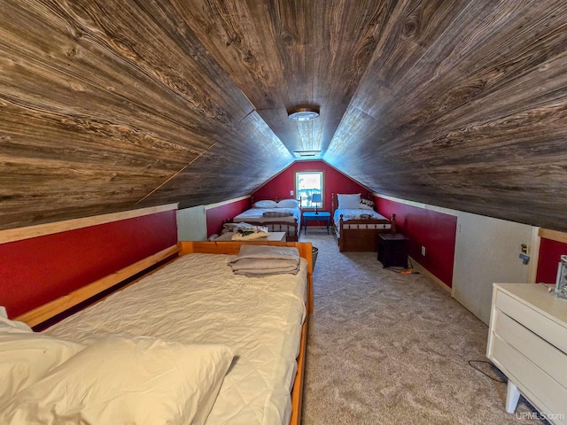 bedroom with lofted ceiling, wooden ceiling, and carpet floors