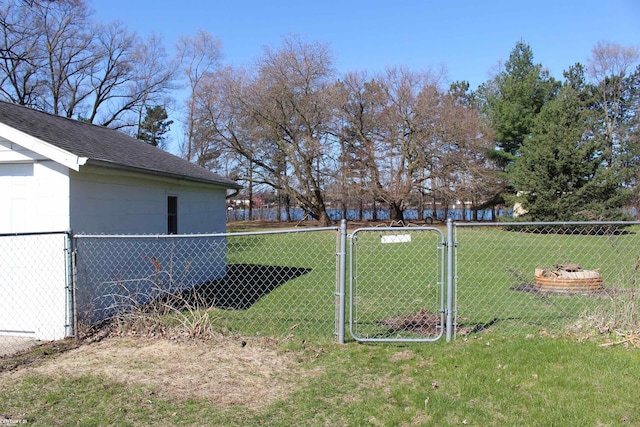 view of yard featuring fence and a gate