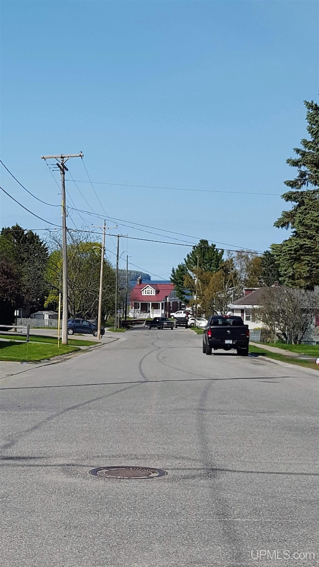 view of road featuring curbs