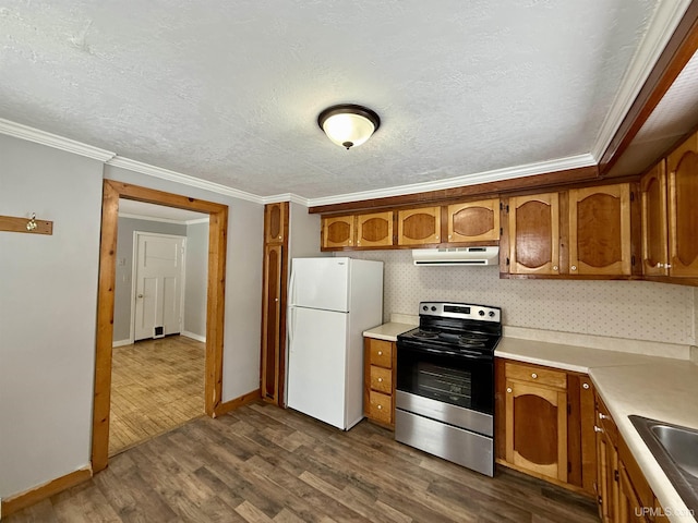 kitchen with dark wood-style floors, freestanding refrigerator, electric range, brown cabinetry, and ventilation hood
