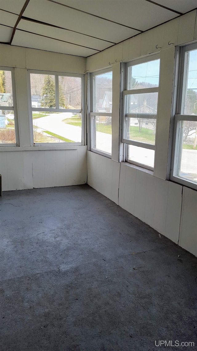unfurnished sunroom with a healthy amount of sunlight