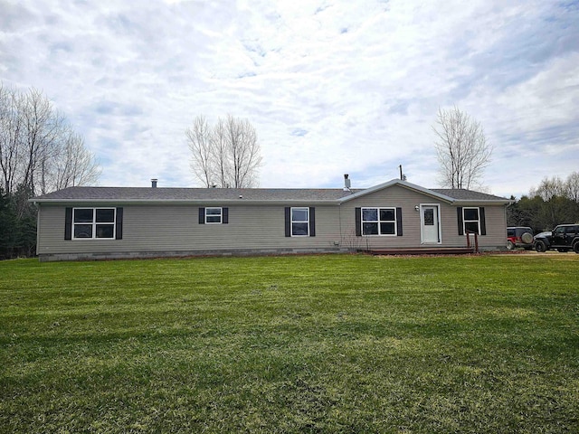 ranch-style house featuring a front lawn
