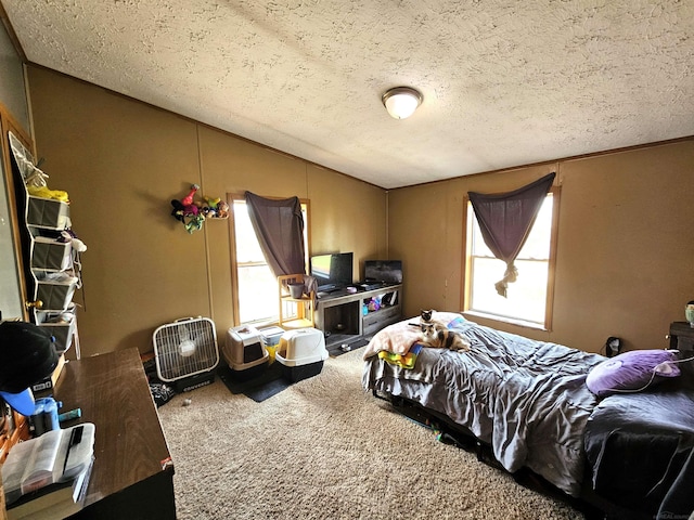 carpeted bedroom featuring vaulted ceiling and a textured ceiling