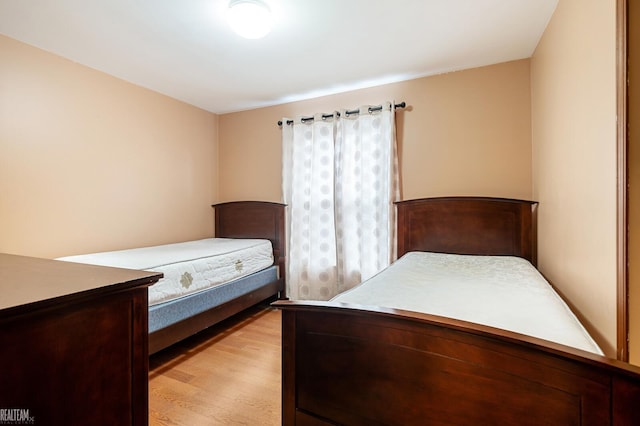 bedroom with light wood-style flooring