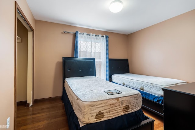 bedroom with wood finished floors