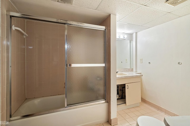 bathroom featuring visible vents, toilet, vanity, shower / bath combination with glass door, and tile patterned flooring