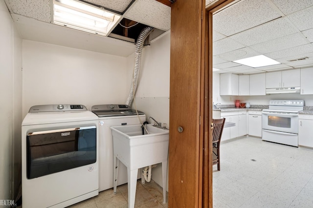 laundry room with separate washer and dryer, visible vents, and light floors