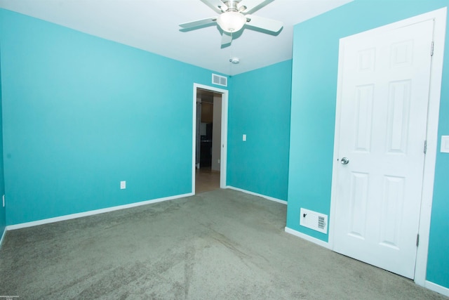 unfurnished bedroom with visible vents, baseboards, and carpet flooring