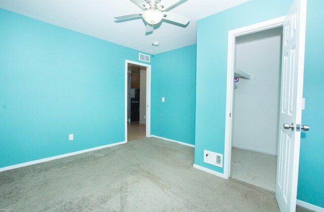 unfurnished bedroom featuring baseboards, visible vents, and carpet floors
