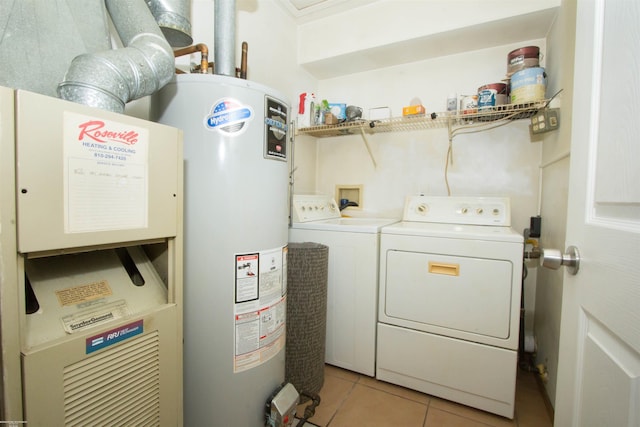 laundry room featuring gas water heater, separate washer and dryer, laundry area, and light tile patterned flooring