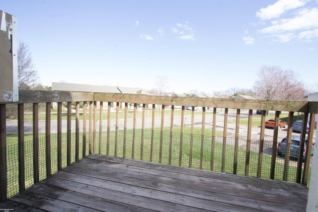 deck featuring a lawn