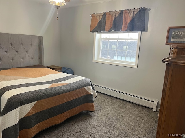 bedroom with baseboard heating and carpet flooring