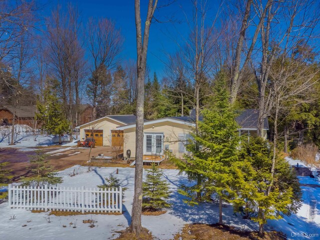 view of front of home featuring french doors and a fenced front yard