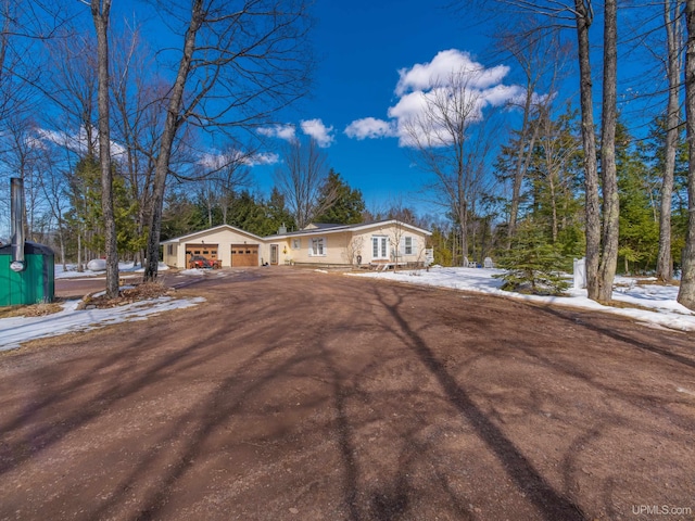 single story home featuring a garage